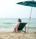Folly Beach chair rental with umbrella setup for one person, beach chair with leg rest and shade perfect for a relaxing solo beach day near Charleston