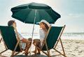 Folly Beach chair rentals for two with umbrella, comfortable beach setup perfect for couples, friends, or a small group beach day in Charleston